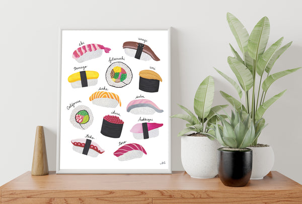 Sushi print with white frame on wooden table and green plants